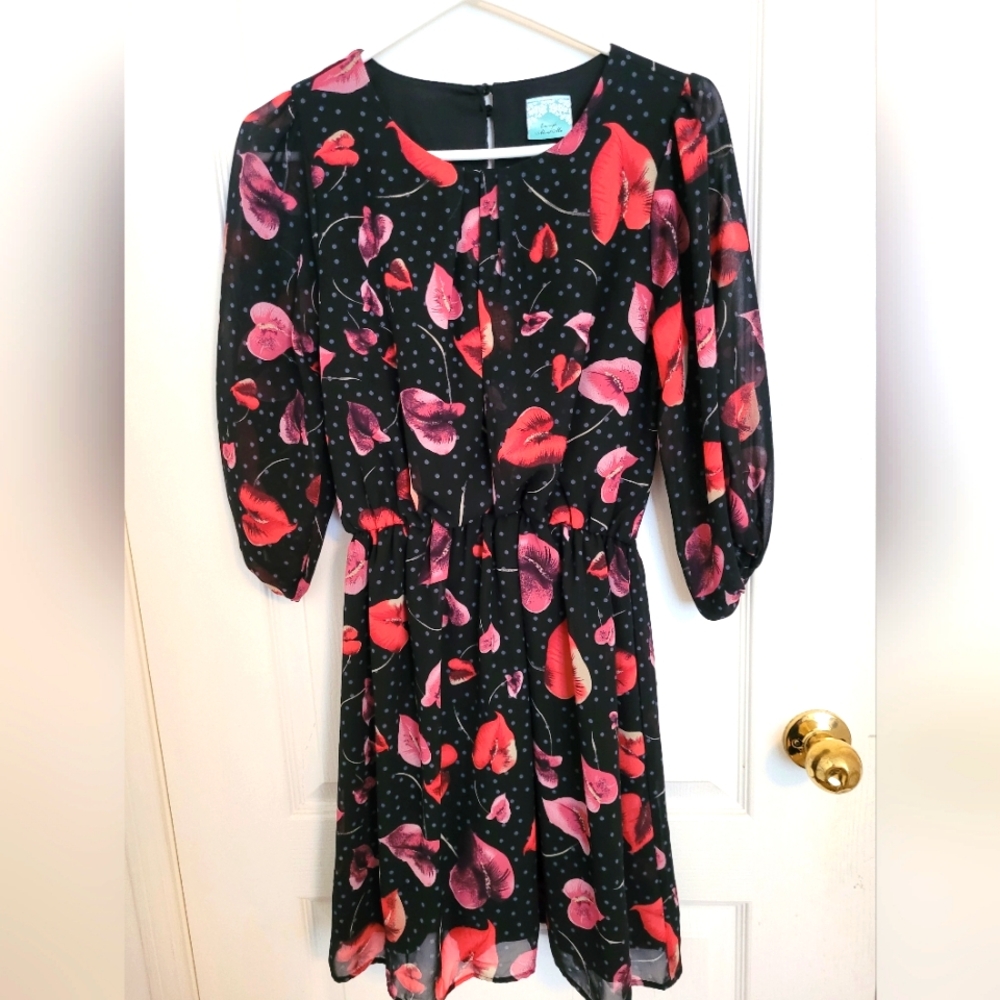 Elegant Black Dress with Red Floral Design